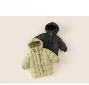 Detailed view of quilted black and green kids down jackets with warm hooded design