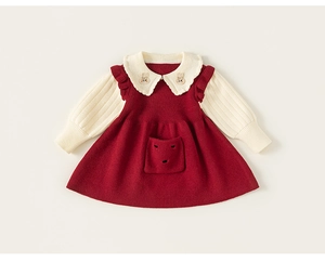 Detail of red knit dress showing rabbit applique on collar and soft ribbed texture
