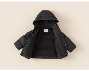 Close-up of matte black kids puffer jacket featuring quilted design and hooded neckline