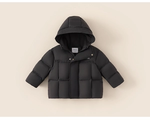 Detailed close-up of children's black hooded down jacket with zipper and snap buttons