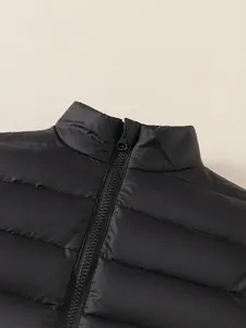 Doudoune légère matelassée noire pour enfants avec col montant et fermeture éclair