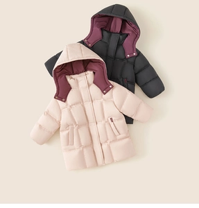 Detail view of quilted long down jackets for kids in pink and black with contrast hoods
