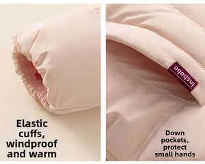 Detail of pink kids down coat showing elastic windproof cuffs and warm down pockets