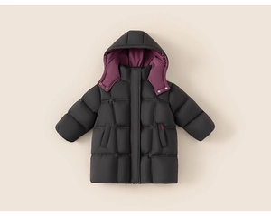 Detail of children's long black down jacket with purple hood lining and quilted design