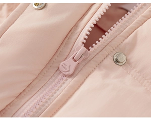 Detail of pink puffer coat featuring premium plastic zipper and silver metal snap buttons