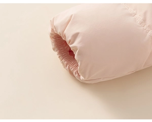 Close-up of pink down jacket elastic cuffs and windproof fabric texture details