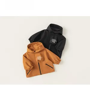 Detail of hooded jackets for boys showing zipper closure and elastic cuffs in two colors