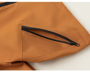 Close-up of waterproof black zipper and technical fabric on boys outdoor hooded jacket