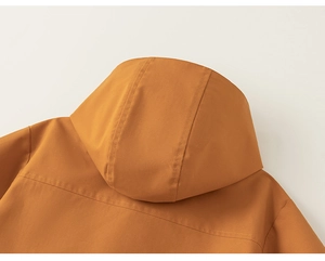 Detailed close-up of hooded neckline and back yoke stitching on kids caramel jacket