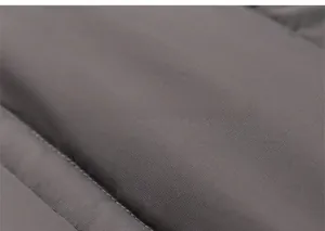 Detailed macro view of high-density quilted fabric on girl's thick winter down jacket