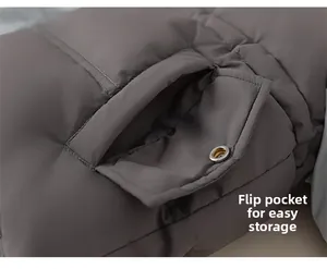 Detailed view of the flap pocket with metal snap button on a girls' down jacket
