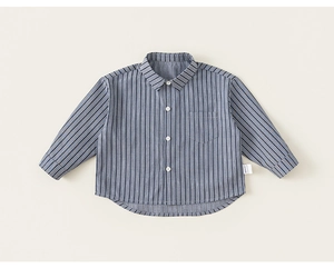 Detail of blue and white vertical striped toddler shirt with chest pocket and buttons
