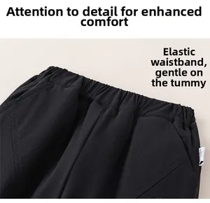Detailed close-up of elastic waistband on black cotton children trousers for extra comfort