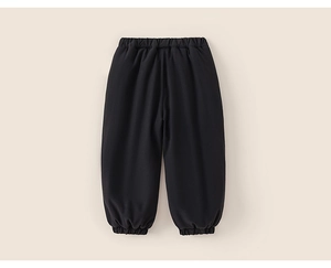 Detail of classic black thick joggers with elastic waistband and cuffs for kids