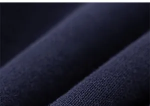 Detailed macro view of dark blue striped knit fabric texture on kids' sweatshirt set