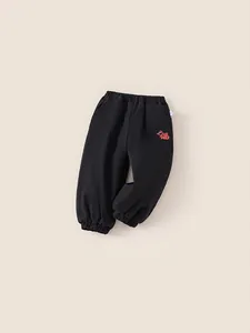 Thick black cotton sweatpants for boys featuring festive red Chinese Fu character print