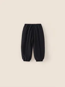 Thick black cotton joggers for boys featuring elastic waist and ribbed cuffs for winter