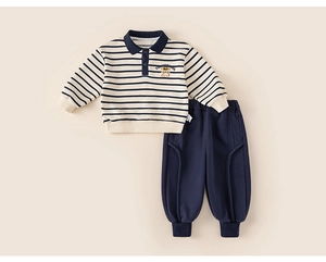Detail of boys' striped polo sweatshirt and navy jogger set with elastic waistband