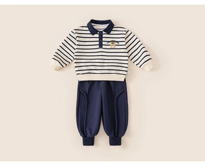 Detail of boys striped polo sweatshirt and joggers set featuring Tenderness 23 print