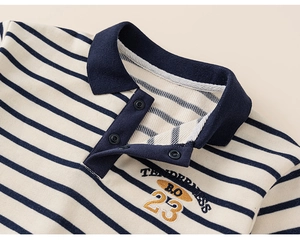 Close-up of boys' striped polo collar with tenderness embroidery and metal snap buttons