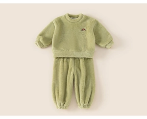 Detail of soft olive green fleece pajama set with a small cartoon character embroidery