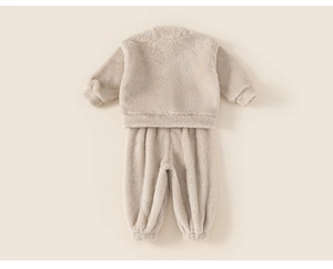 Detail view of cream white fleece thermal loungewear set for toddlers with elastic cuffs