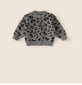 Detail of leopard print knitted cardigan for girls featuring elegant wooden buttons