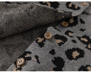 Detail of leopard print knit cardigan showing soft fabric texture and brown buttons