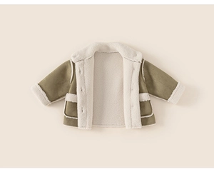 Close-up of olive green suede jacket featuring warm white faux shearling lining and pockets