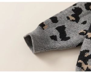 Detail of leopard print knit cardigan sleeve with ribbed cuff for kids' sweater