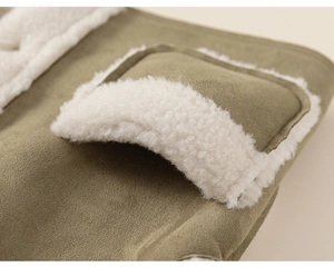 Detail of olive green suede fabric with white sherpa trim and neat stitching on kid jacket