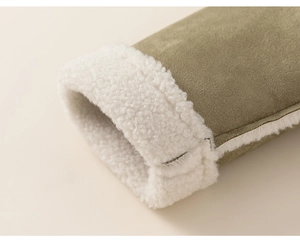 Detail of olive green suede cuff with thick white faux shearling lining for warmth