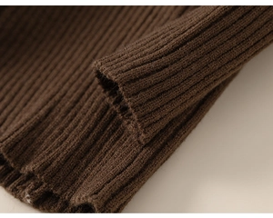 Close-up of deep brown ribbed knit fabric showing soft texture and premium elasticity