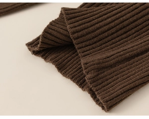 Close-up of the ribbed knit cuffs and hem on this warm dark brown winter sweater