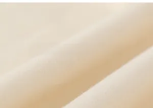 Gros plan sur la texture du tissu en maille de coton doux pour pantalons d'enfants