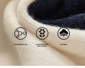Detailed macro view of thick knit fabric with soft texture and two-tone stitching