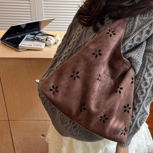 Brown vintage suede tote bag with floral cutouts and spacious hobo design for women