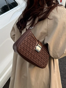 Minimalist dark brown woven leather shoulder bag with metallic buckle and retro style