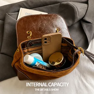 Detailed internal capacity view of the vintage brown saddle bag with premium lining