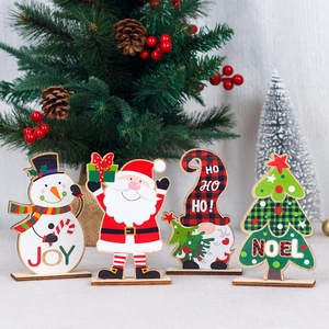 Set of four wooden Christmas desktop ornaments featuring Santa, Snowman and Gnome