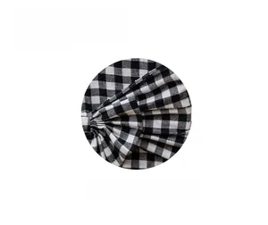 Detail showing high-quality black and white plaid fabric texture for Christmas decor