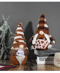 Close-up of two coffee-themed gnomes with COFFEE cup details and brown knit textures