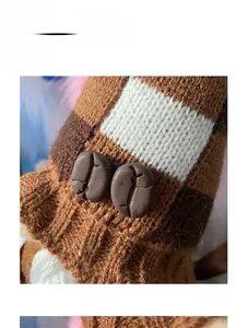 Close-up of knit fabric texture with coffee bean accents on a festive gnome doll