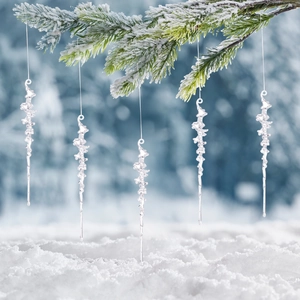 5-piece clear acrylic icicle ornaments hanging on snowy pine branches for Christmas decor