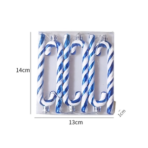 Macro view showing dimensions of blue and white striped Christmas candy cane ornaments