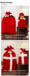 Detail of red flocked Christmas candy bags with belt design and plush drawstring closure