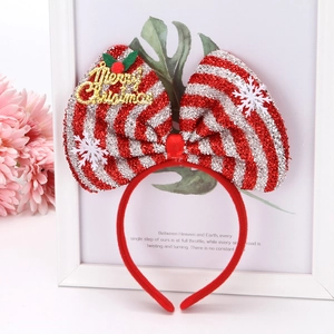 Detail of Christmas headband with red silver sequin bow and Merry Christmas text