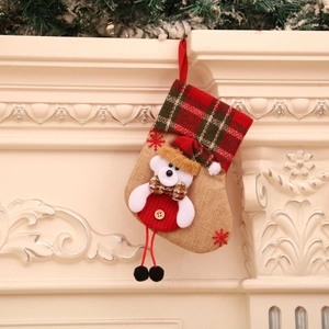 Hessian Christmas stocking with red plaid cuff and 3D plush white bear ornament decoration