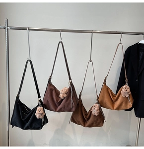 Collection of suede hobo bags in four earthy colors with cute teddy bear charms