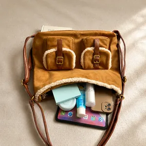 Top-down view of spacious suede tote bag interior with lamb wool trim and pockets